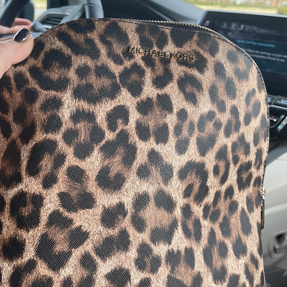 Michael Kors backpack.  Gently used with some wear on upper handles.  No rips.